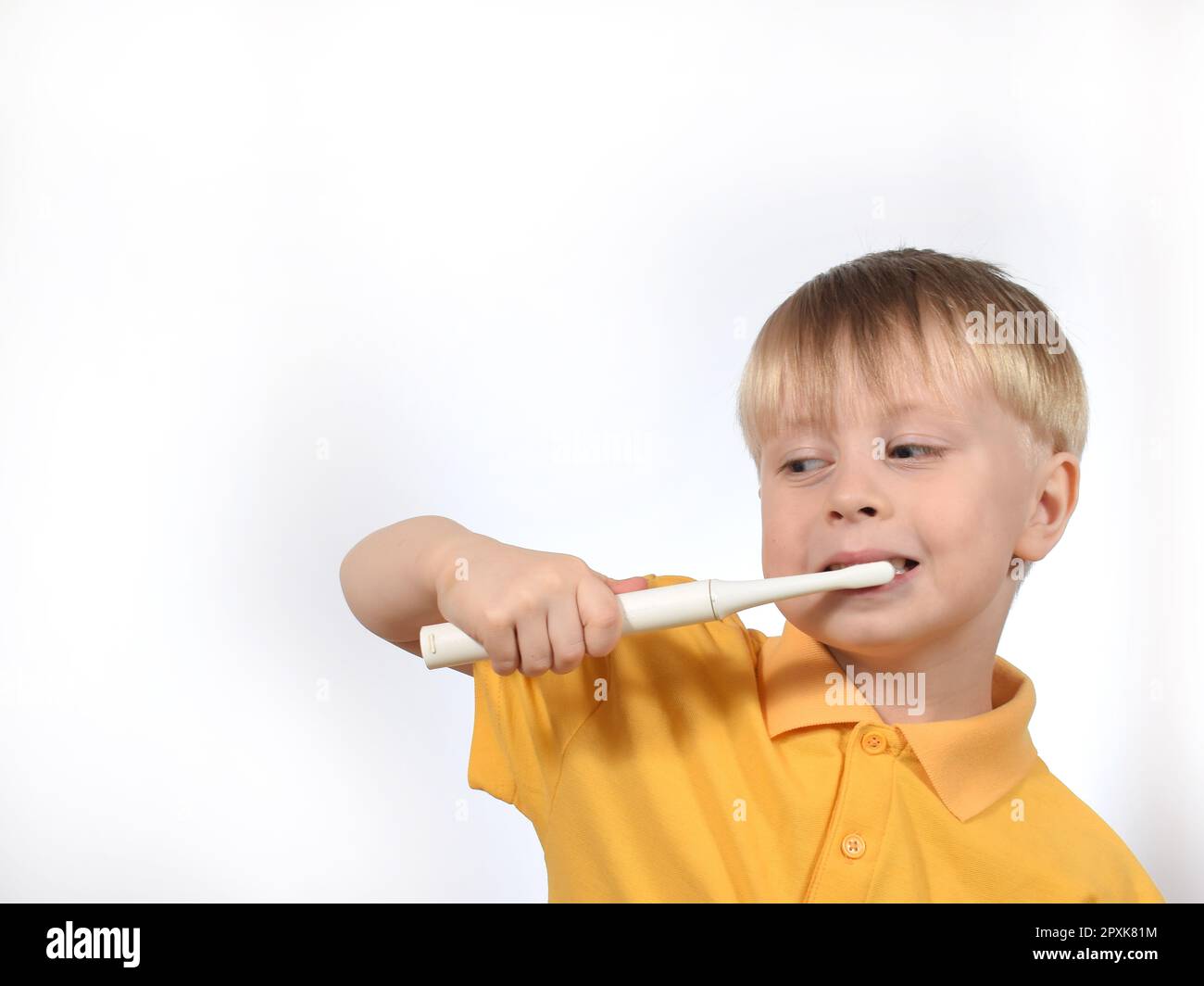 a boy child brushes his teeth with a smart toothbrush Stock Photo Alamy