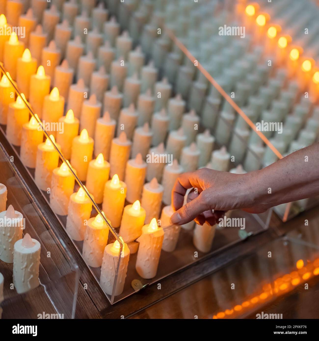 Candles that are lit with alms inside Catholic churches in Spain Stock