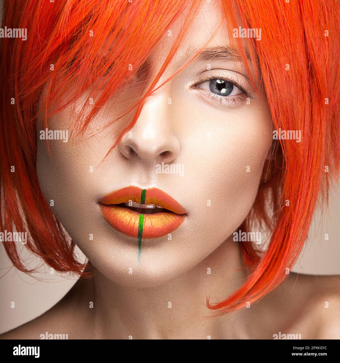 Beautiful girl in an orange wig cosplay style with bright creative lips ...