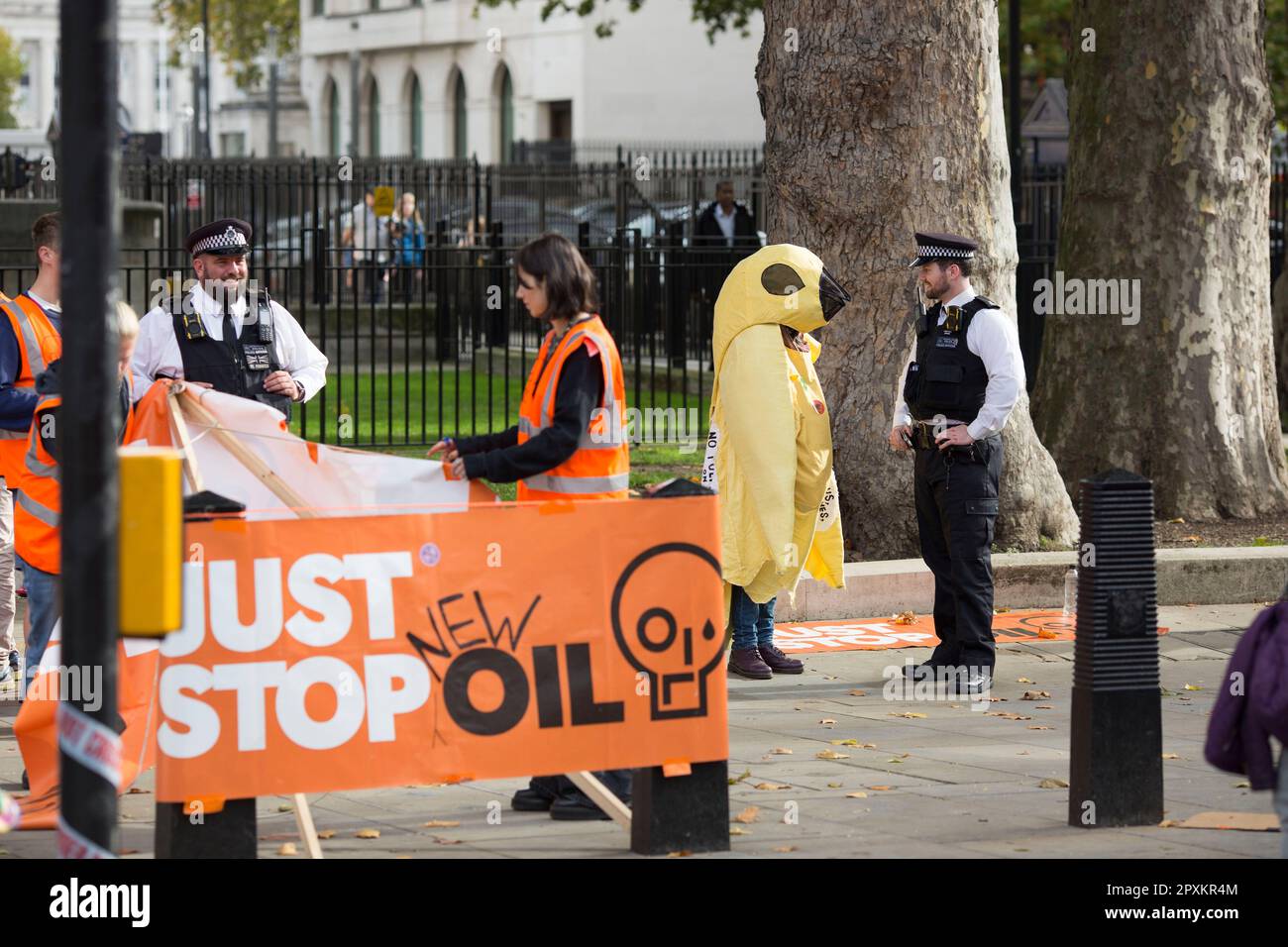 Police officers talk to Just Stop Oil activists in Westminster, central