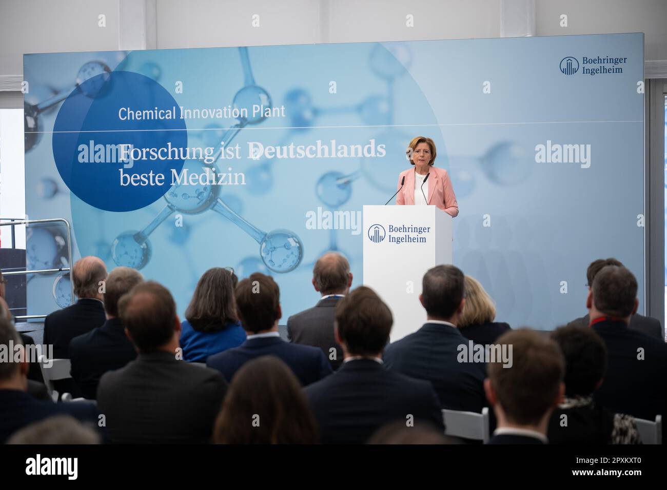 Ingelheim, Germany. 02nd May, 2023. A woman holds a time capsule during the  groundbreaking ceremony for Boehringer Ingelheim's Chemical Innovation Plant  (CIP), which reads "Groundbreaking ceremony Chemical Innovation Plant  02.05.2023". At the