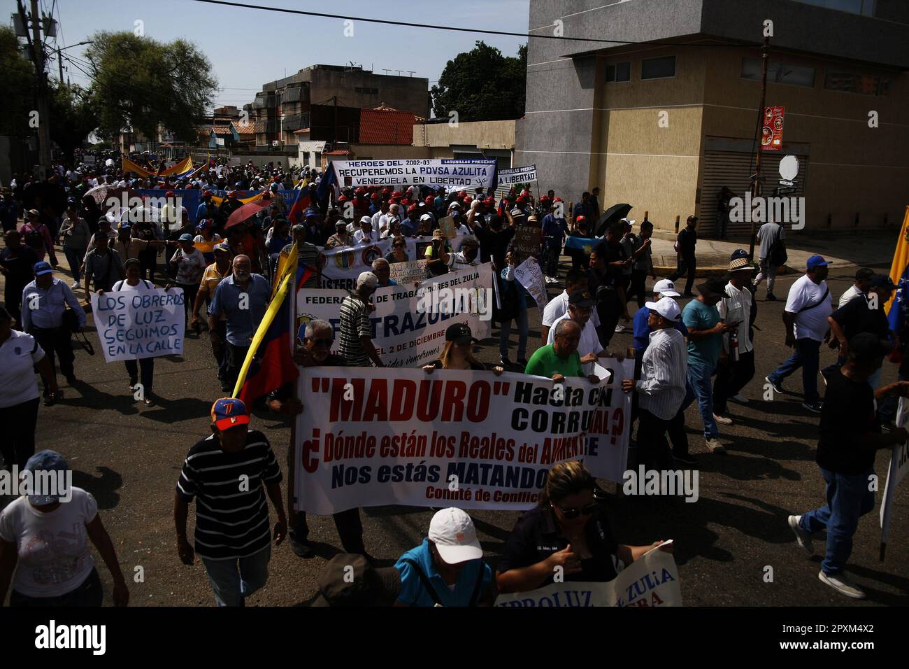 Venezuelan workers take to the streets in protest to demand an increase in the minimum wage, on Monday May 1, 2023 in the city of Maracaibo, Venezuela. Unions, teachers, workers and workers in the health sector declared 'agree on the street as an exit if there is no adjustment to the minimum wage, as established by the constitution.' They will not accept bonuses for the Patria System, but a decent salary adjustment that covers the basket basic food and social protection for their families. (Photo by Humberto Matheus/Sipa USA) Stock Photo