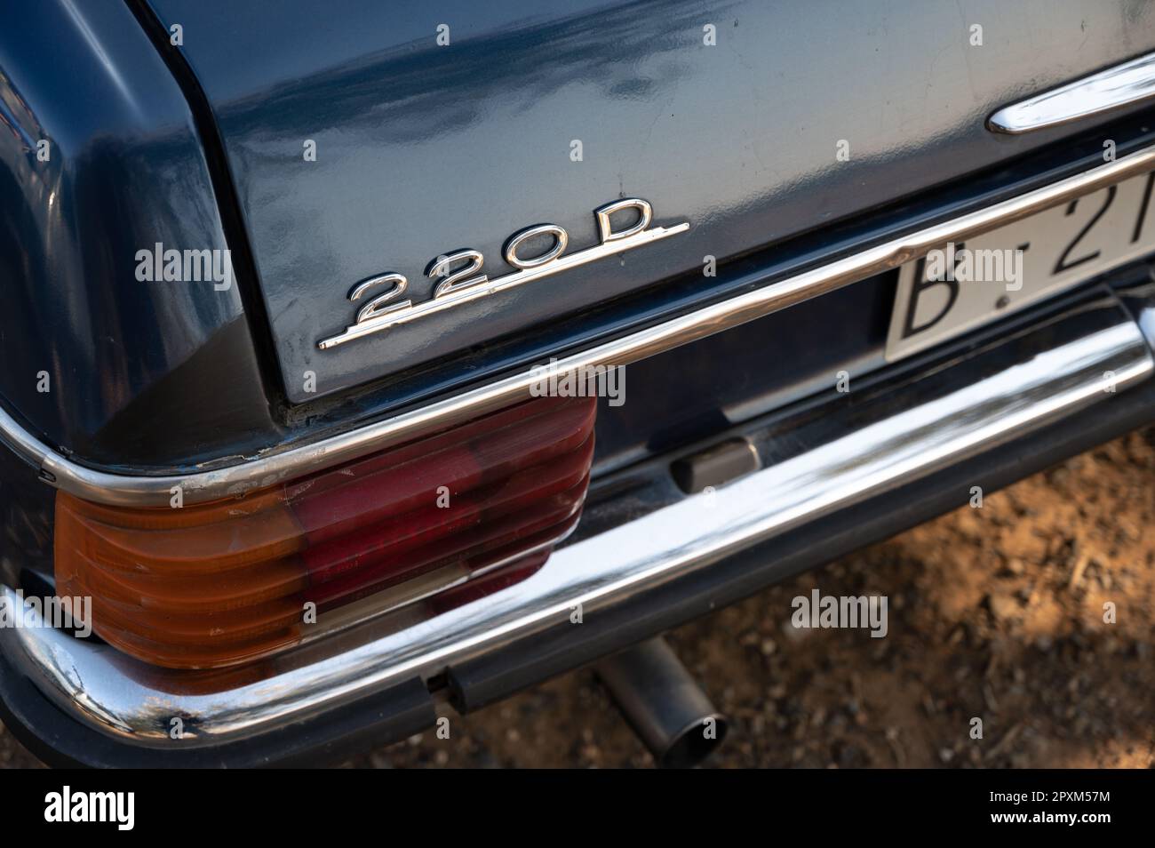 Detail of the logo of a German luxury classic, it is a blue Mercedes Benz W115 W114 Stock Photo