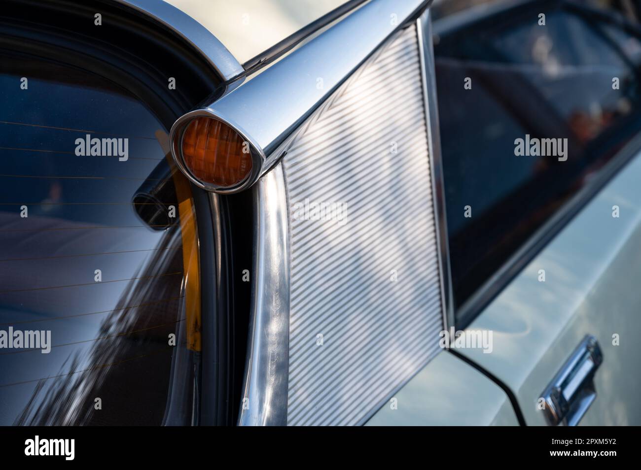 Detail of a beautiful French classic, the Citroen DS D super in white. Rear turn signal detail Stock Photo