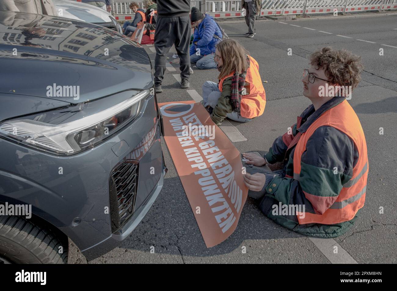 Berlin, Germany. May 2, 2023, Berlin, Germany: On Tuesday morning, May 2, 2023, the climate activist group 'Last Generation' once again blocked several streets in Berlin. The actions led to significant disruptions and traffic jams throughout the city. Several major roads and intersections were affected. The roadblocks have sparked controversy and anger from members of the public who view them as a disruption to daily life and a violation of their rights to free movement. Credit: ZUMA Press, Inc./Alamy Live News Stock Photo