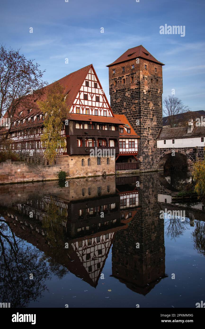 Vertical View of Water Tower in Nuremberg. Famous Monument with Water Reflection in Germany. Bavarian Architecture during Autumn. Stock Photo
