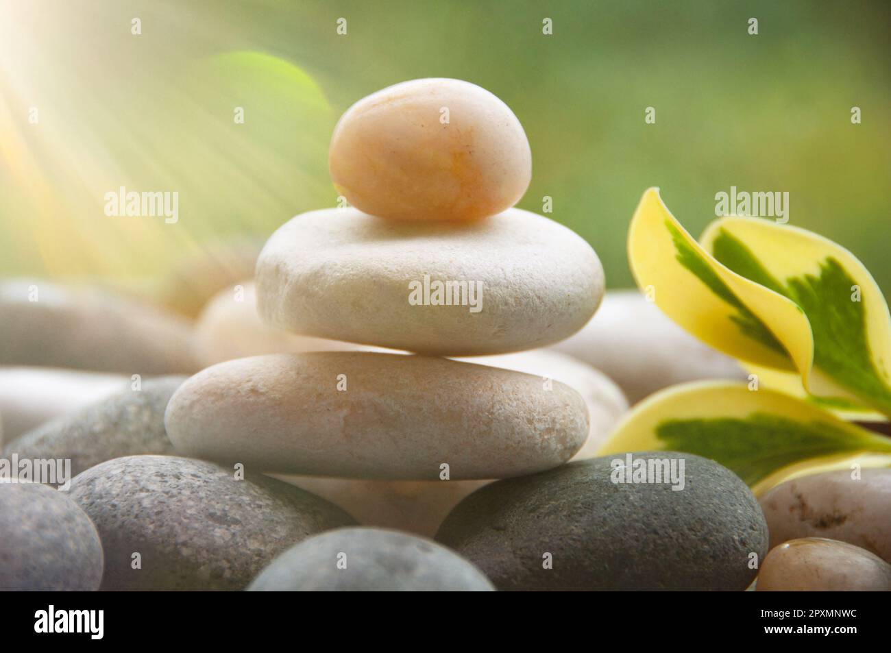 Light shining on zen stones with customizable space for text. Copy ...