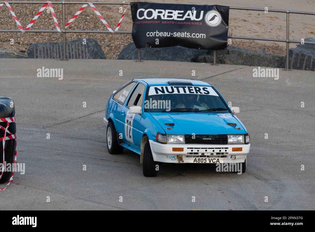 Robert Nutter racing a Toyota Corolla AE86 competing in the Corbeau Seats rally on the seafront at Clacton, Essex, UK. Co driver Simon Nutter Stock Photo