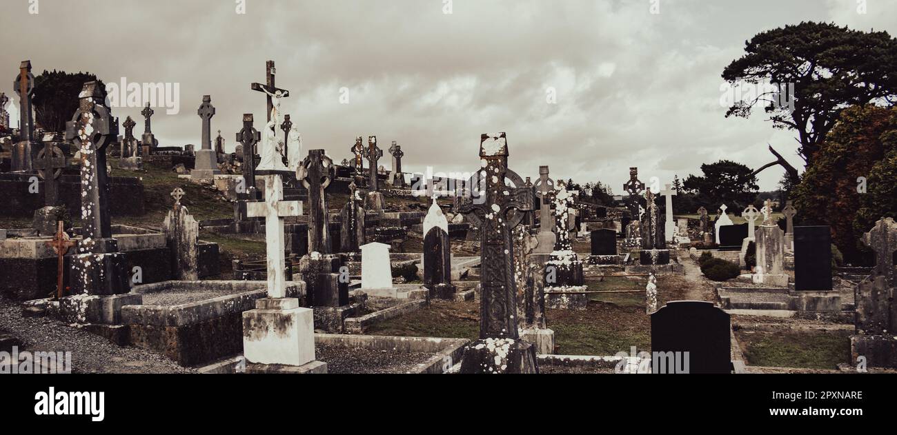 An cemetery in Ireland. Stone tombstones, Celtic cross. Christian ...