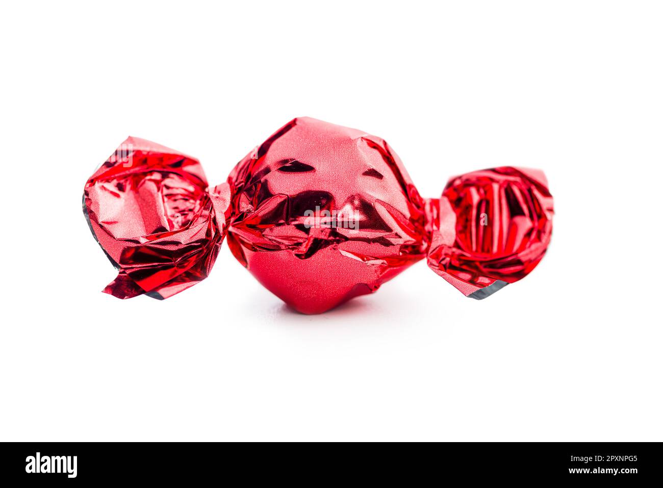 Sweet candy wrapped in foil isolated on the white background Stock