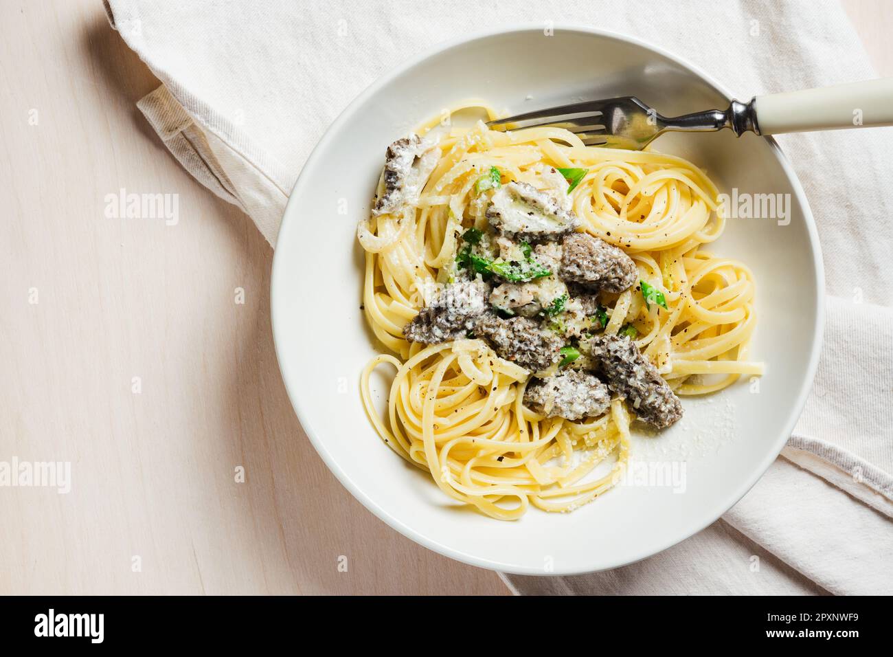 Linguine pasta with morels, cheese and creamy sauce Stock Photo Alamy