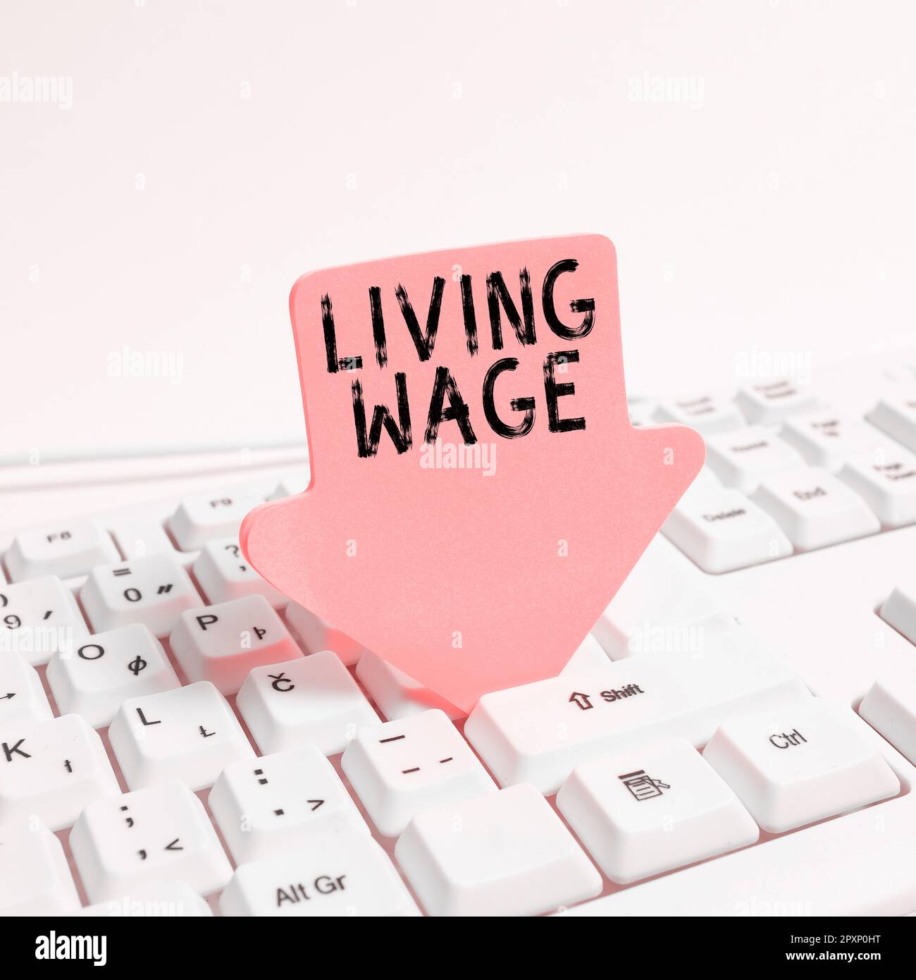Conceptual caption Living Wage, Business idea wage that is high enough to maintain a normal standard of living Stock Photo