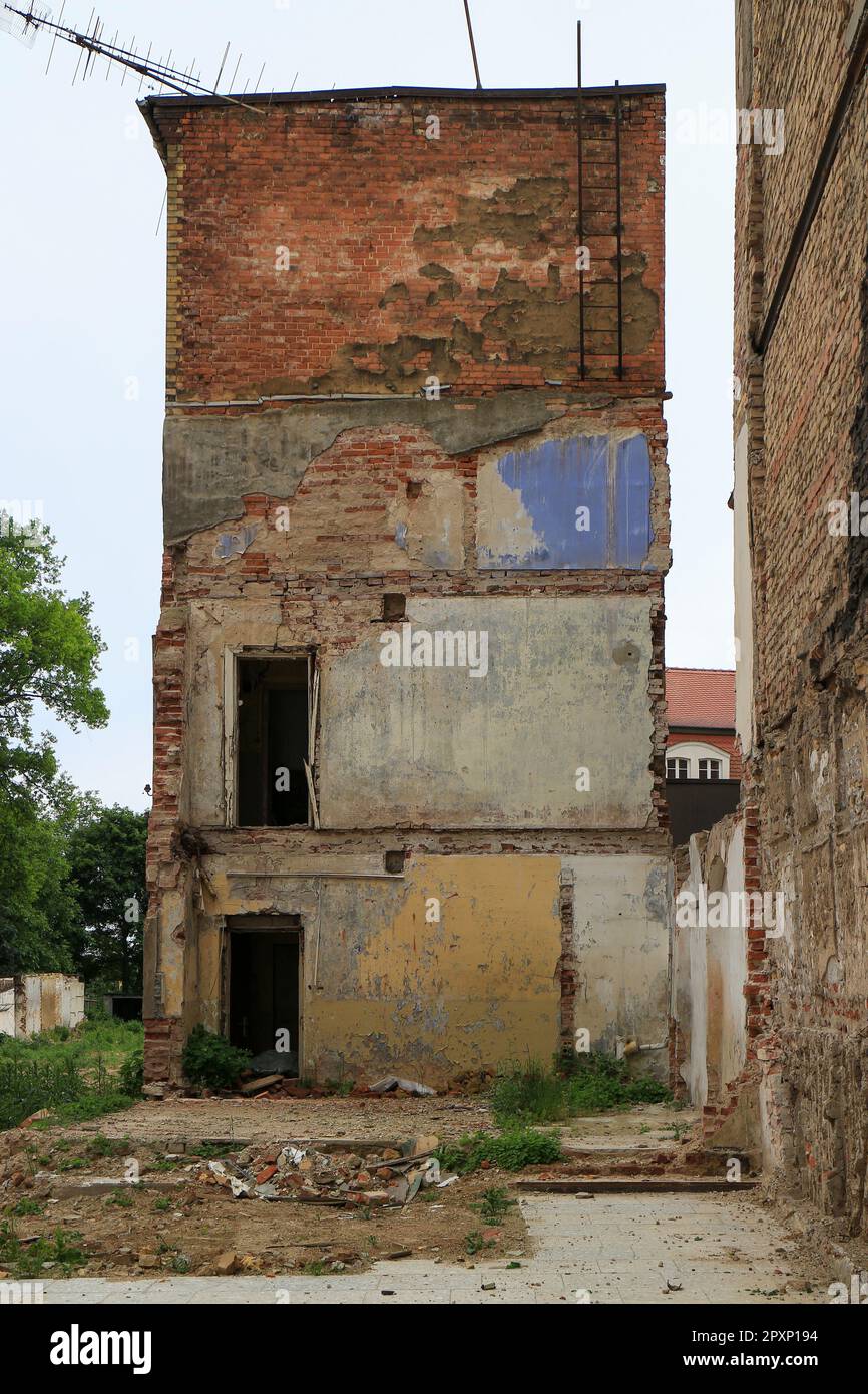 Old partly demolished multi-story house Stock Photo