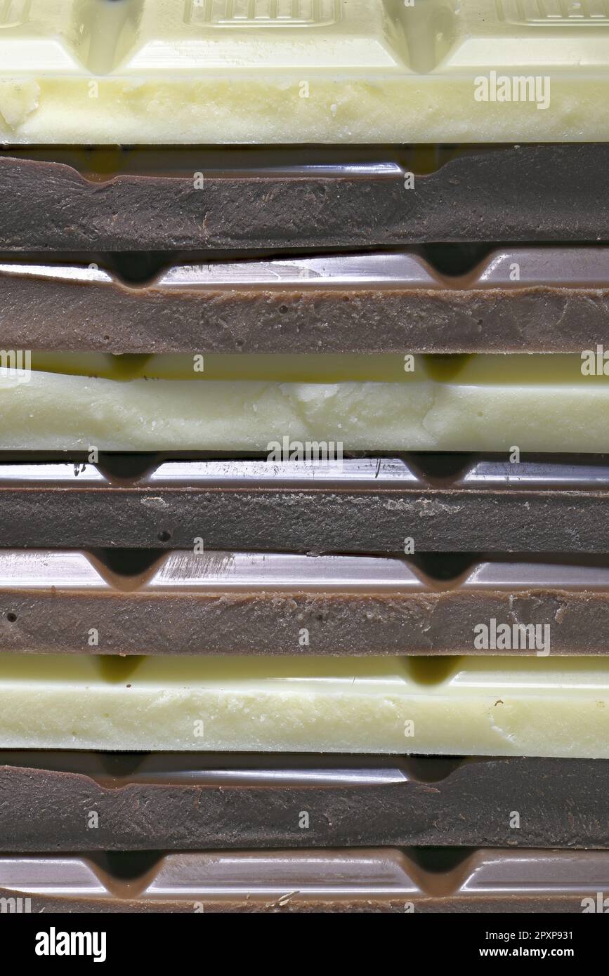 Dark, milk and white chocolate in a stack Stock Photo