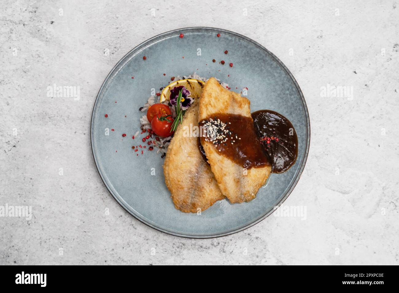 Fried tilapia fish with rice sauce and vegetable Stock Photo Alamy