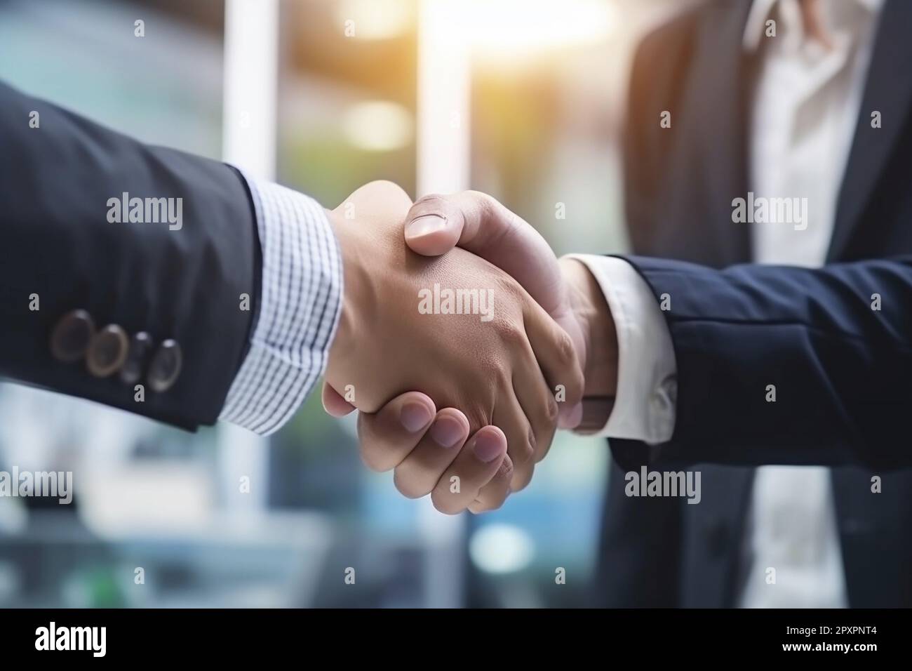 Two men shaking hands with one wearing a suit Stock Photo Alamy