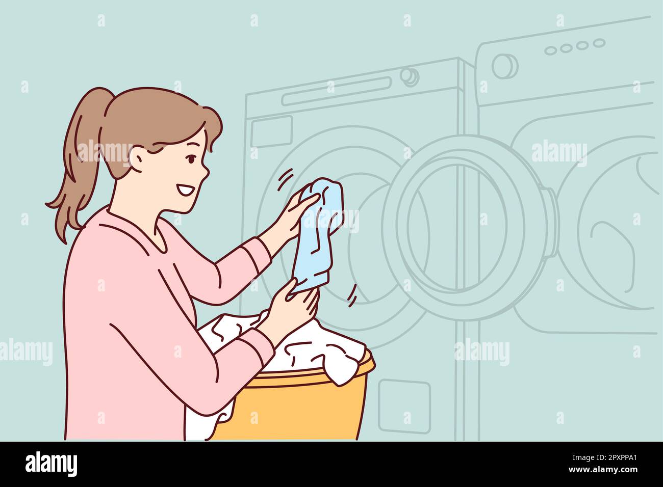 Woman throws dirty laundry into washing machine to make laundry fresh