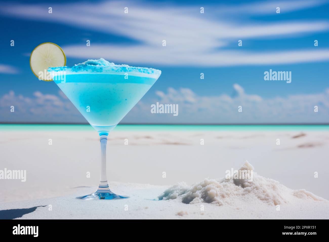 Blue Curacao, martini cocktail with slice of lemon on white beach Stock