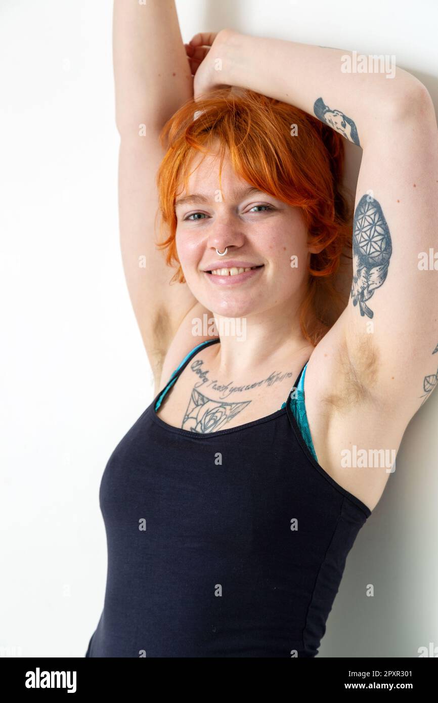 A Beautiful Woman In Her Mid Twenties With Tattoos And Unshaved Armpits