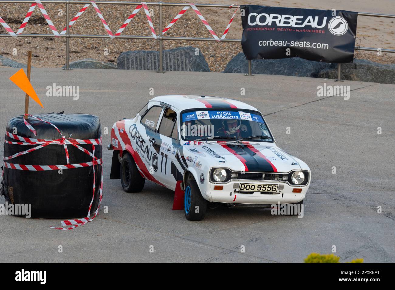 Vince Bristow racing a classic 1969 Ford Escort Mk1 Mexico competing in the Corbeau Seats rally on the seafront at Clacton, Essex, UK Stock Photo