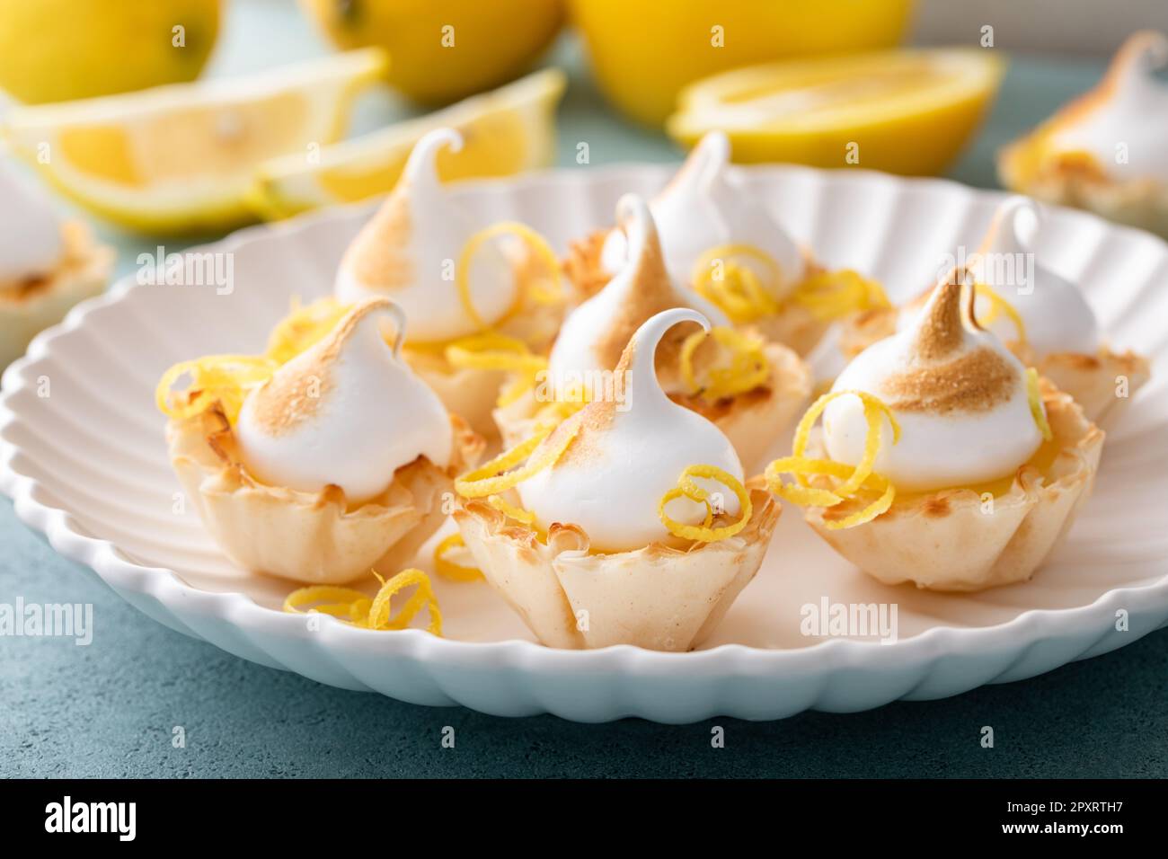 Mini lemon meringue tarts filled with lemon curd, one bite desserts