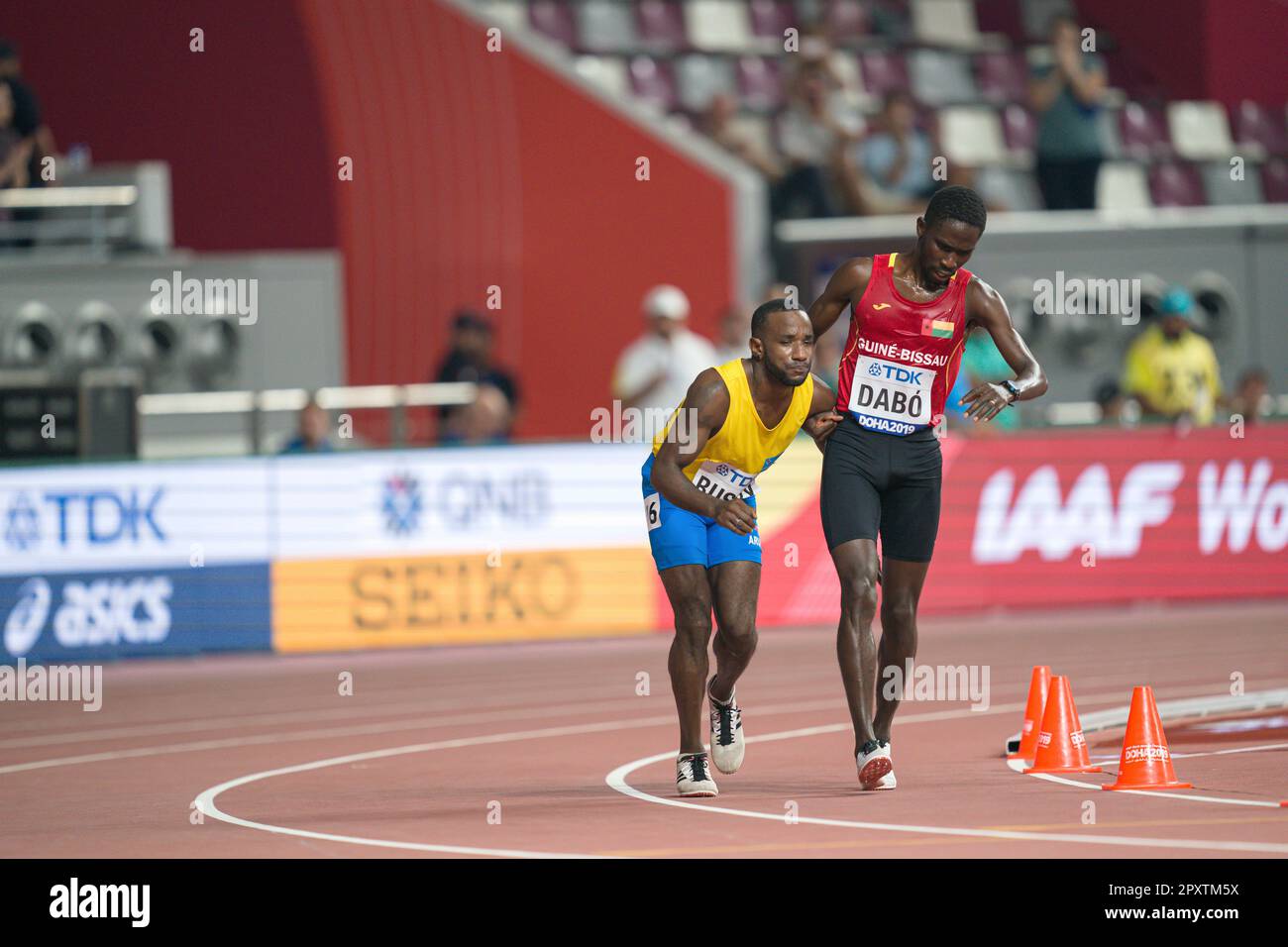 Braima SUNCAR DABO r. (Guinea-Bissau) helps Jonathan BUSBY (Aruba