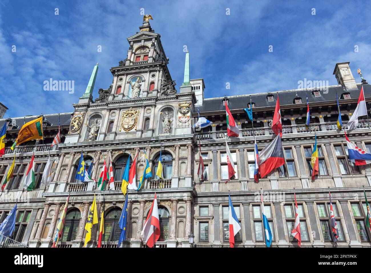 Historic renaissance style town hall, stadhuis, from 16th century with flags in Grote Markt, Old Town, Antwerp UNESCO world heritage site. Stock Photo