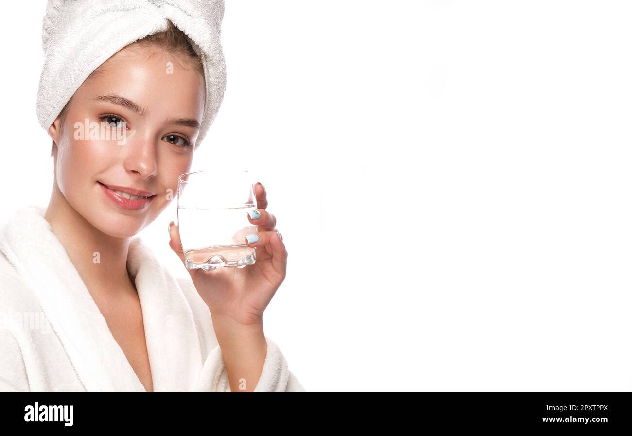 Beautiful tender young girl in a white towel with clean fresh skin ...