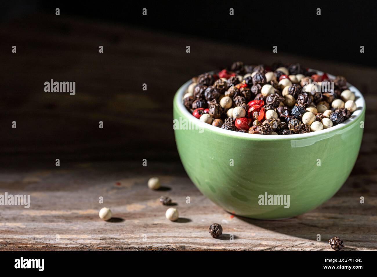 Gourmet peppercorn selection. Black background. Stock Photo
