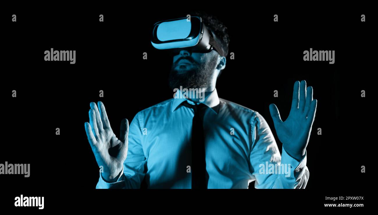 Man Wearing Vr Glasses And Presenting Important Messages Between Hands. Stock Photo