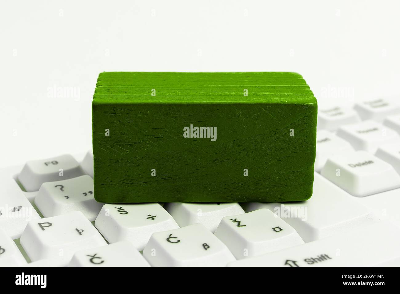 Colored cube with important message lying on keyboard. Main information. Stock Photo