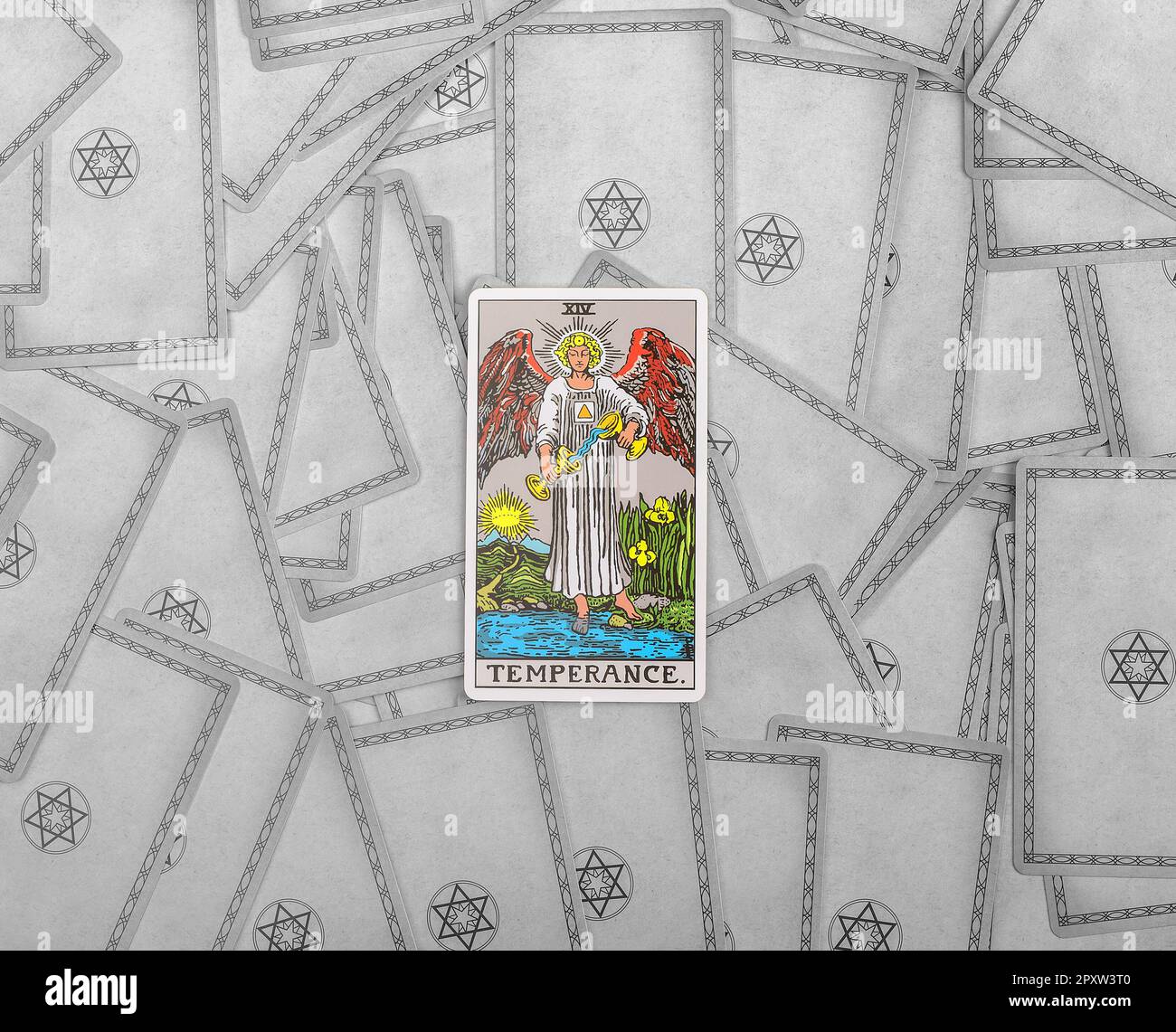 Lodz Poland April 15 2023 Temperance, major arcana on tarot cards background. Taro divination, fortune telling concept. Stock Photo