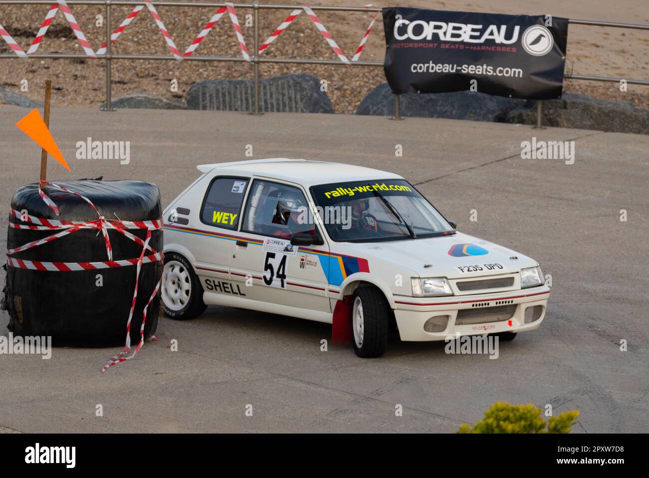 Ross Wey racing a classic 1980s Peugeot 205 GTI competing in the