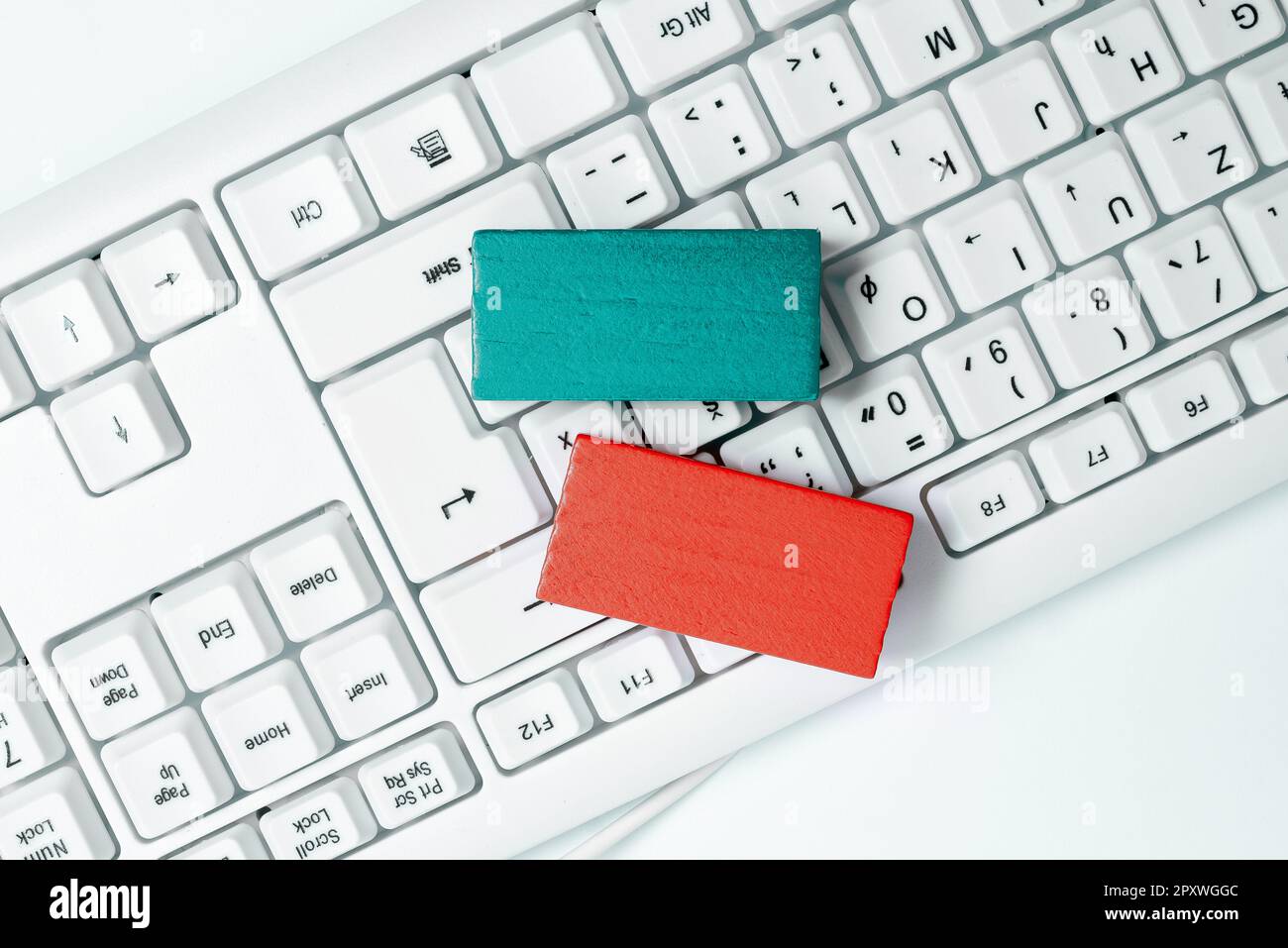 Colored cube with important message lying on keyboard. Main information. Stock Photo