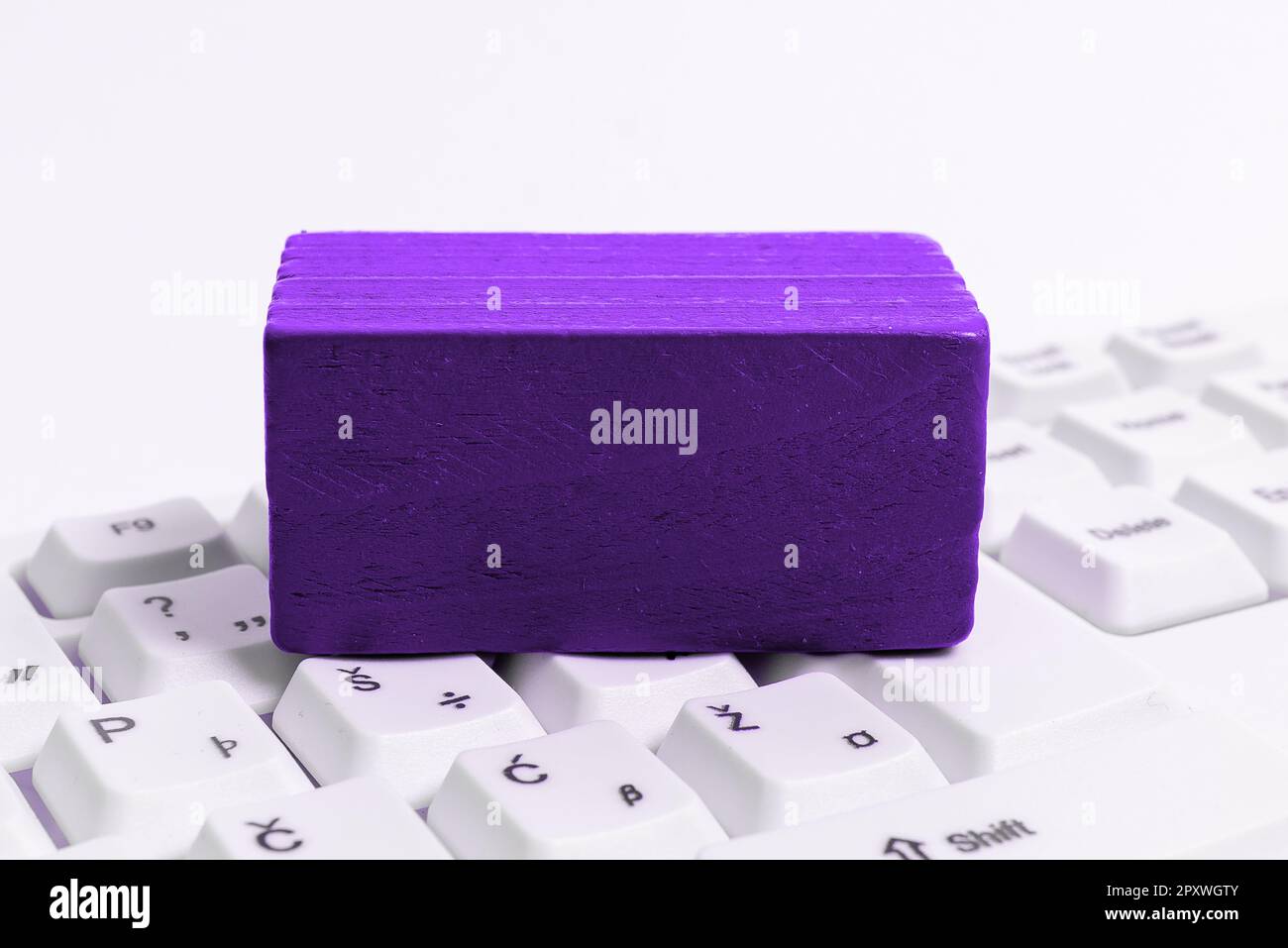 Colored cube with important message lying on keyboard. Main information. Stock Photo