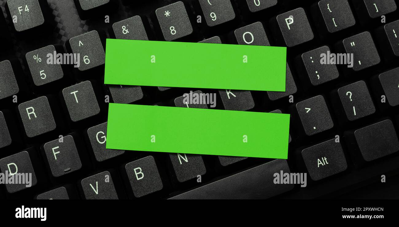 Sticker lying on black keyboard. Important message written over paper ...