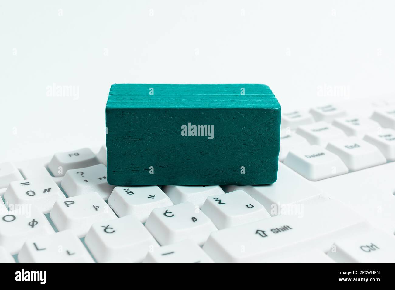 Colored cube with important message lying on keyboard. Main information. Stock Photo
