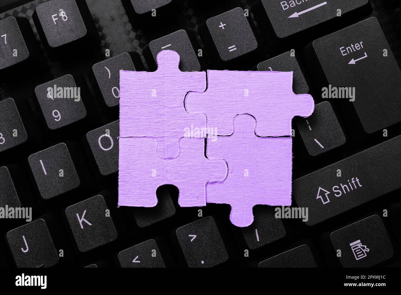 Colored sticker lying on keyboard. Important message written over paper. Stock Photo