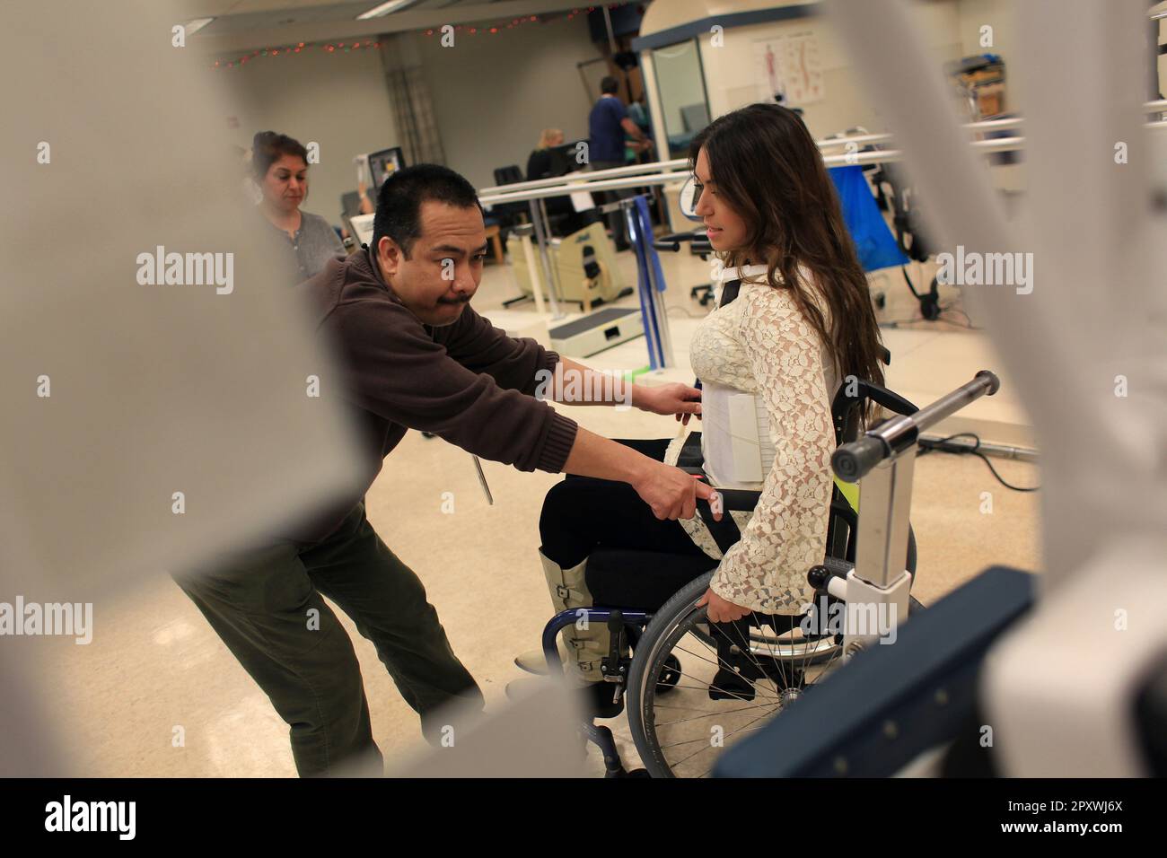 https://c8.alamy.com/comp/2PXWJ6X/katy-sharify-left-who-received-stem-cell-therapy-before-the-study-she-was-part-of-was-cancelled-moves-between-exercise-machines-in-the-cypress-semiconductor-spinal-cord-rehabilitation-gym-with-help-from-physical-therapist-marion-leano-right-at-santa-clara-valley-medical-center-on-tuesday-december-13-2011-in-san-jose-calif-lea-suzukisan-francisco-chronicle-via-ap-2PXWJ6X.jpg