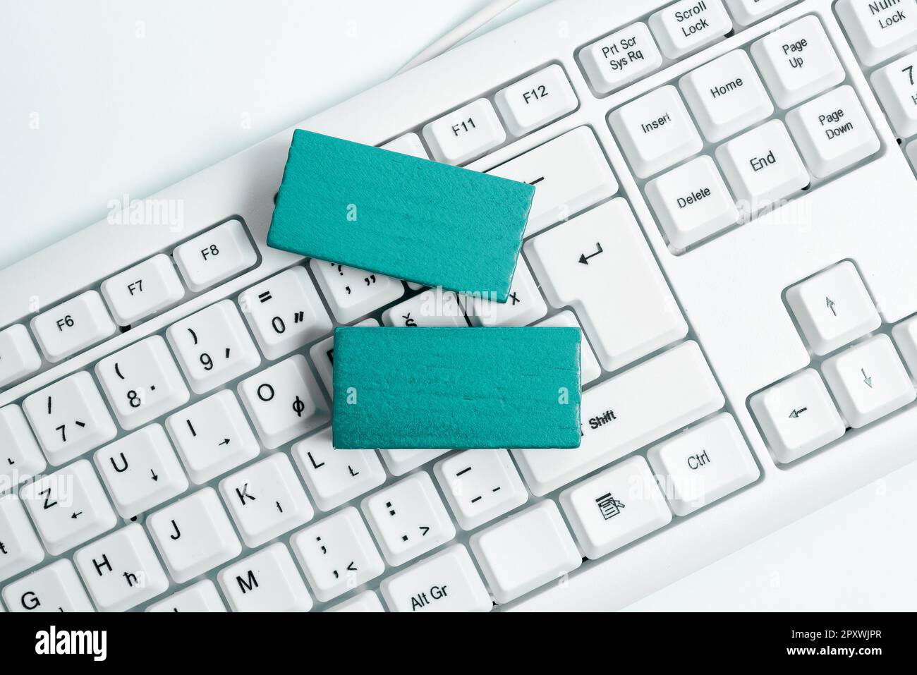 Colored cube with important message lying on keyboard. Main information. Stock Photo