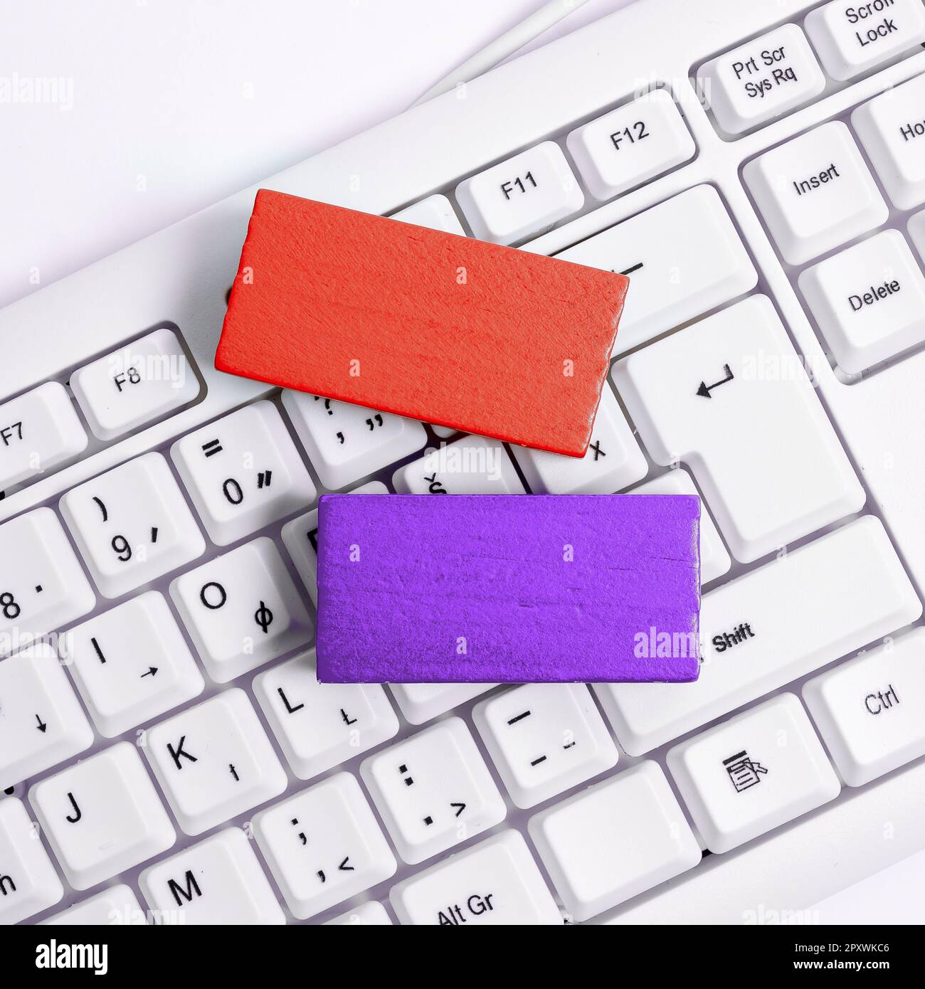 Colored cube with important message lying on keyboard. Main information. Stock Photo