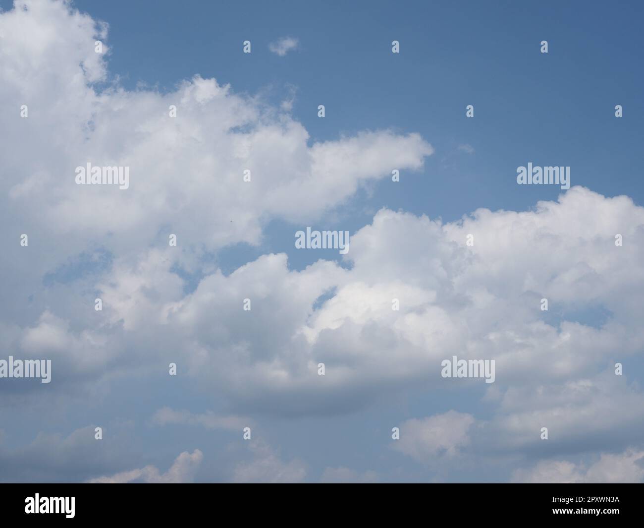 blue sky with clouds useful as a background Stock Photo - Alamy