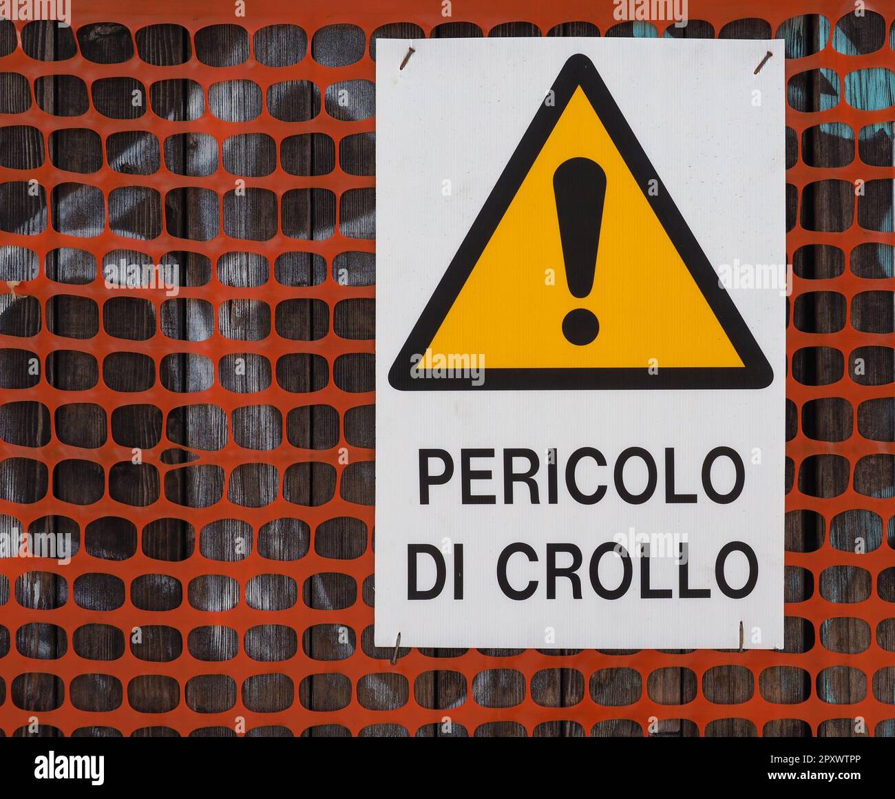 Pericolo di crollo translation Danger of collaps Italian warning sign Stock Photo