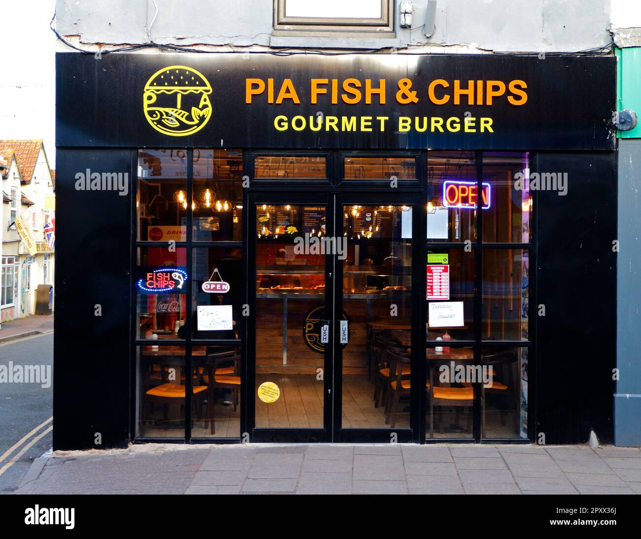 A view of the Pia Fish and Chips and Gourmet Burger shop in the North Norfolk seaside resort of Sheringham, Norfolk, England, United Kingdom. Stock Photo