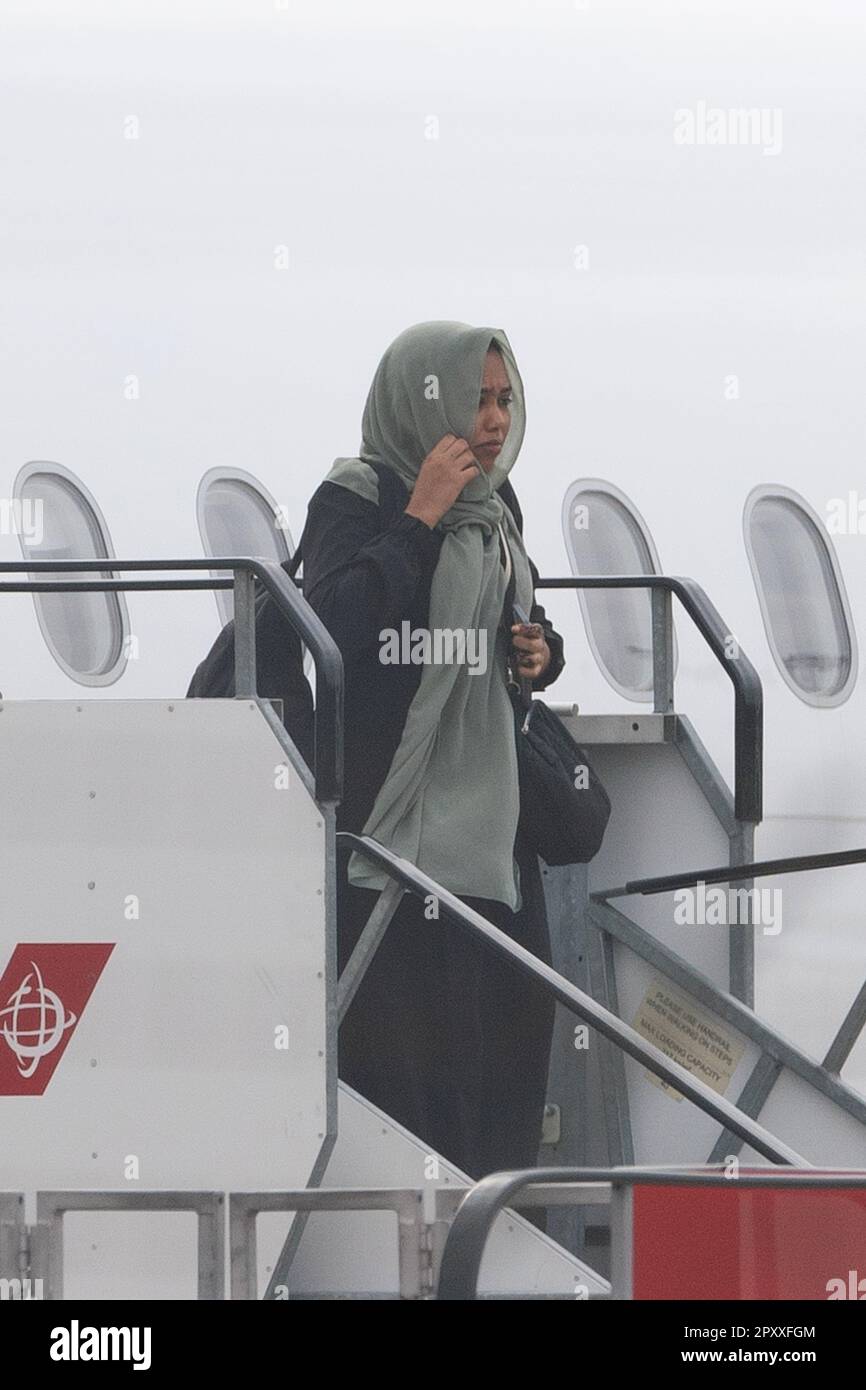 People evacuated from sudan arrive on a flight from cyprus into
