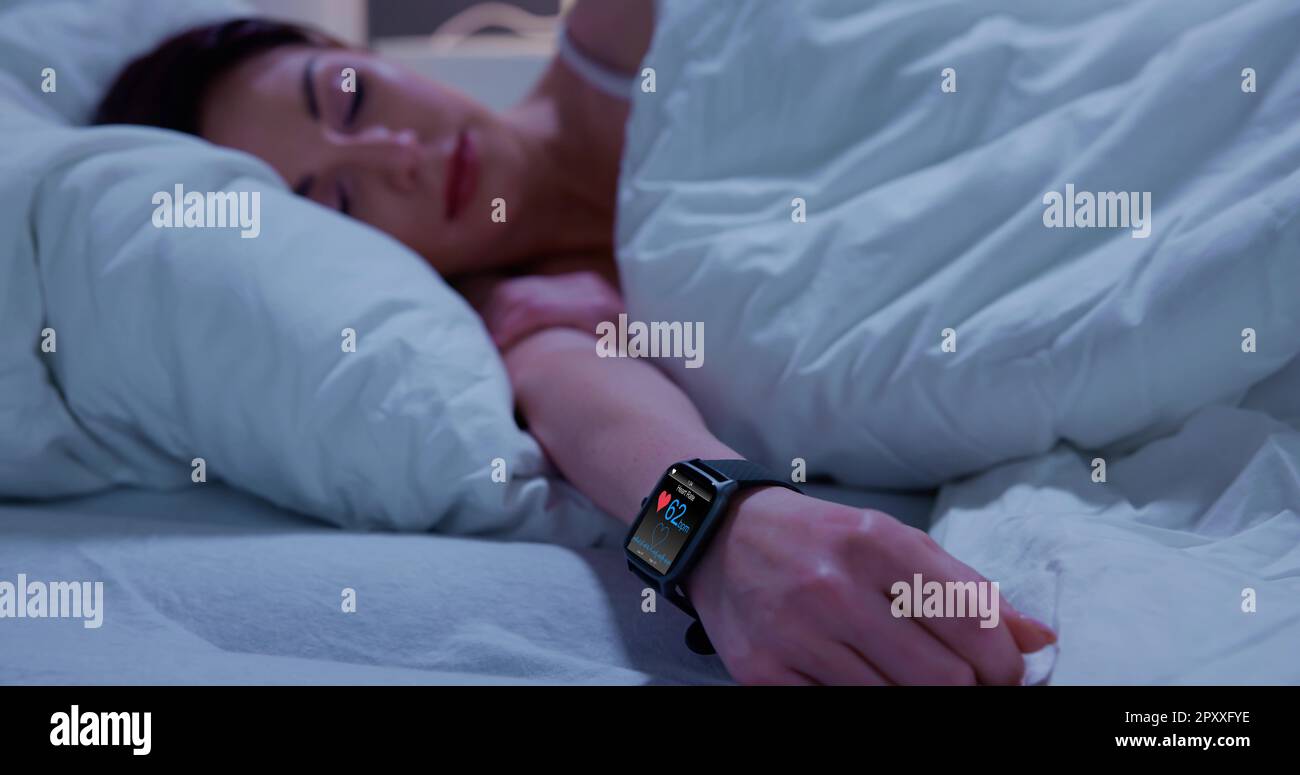 Wearable Sleep Tracking Heart Rate Monitor Smartwatch In Bed Stock
