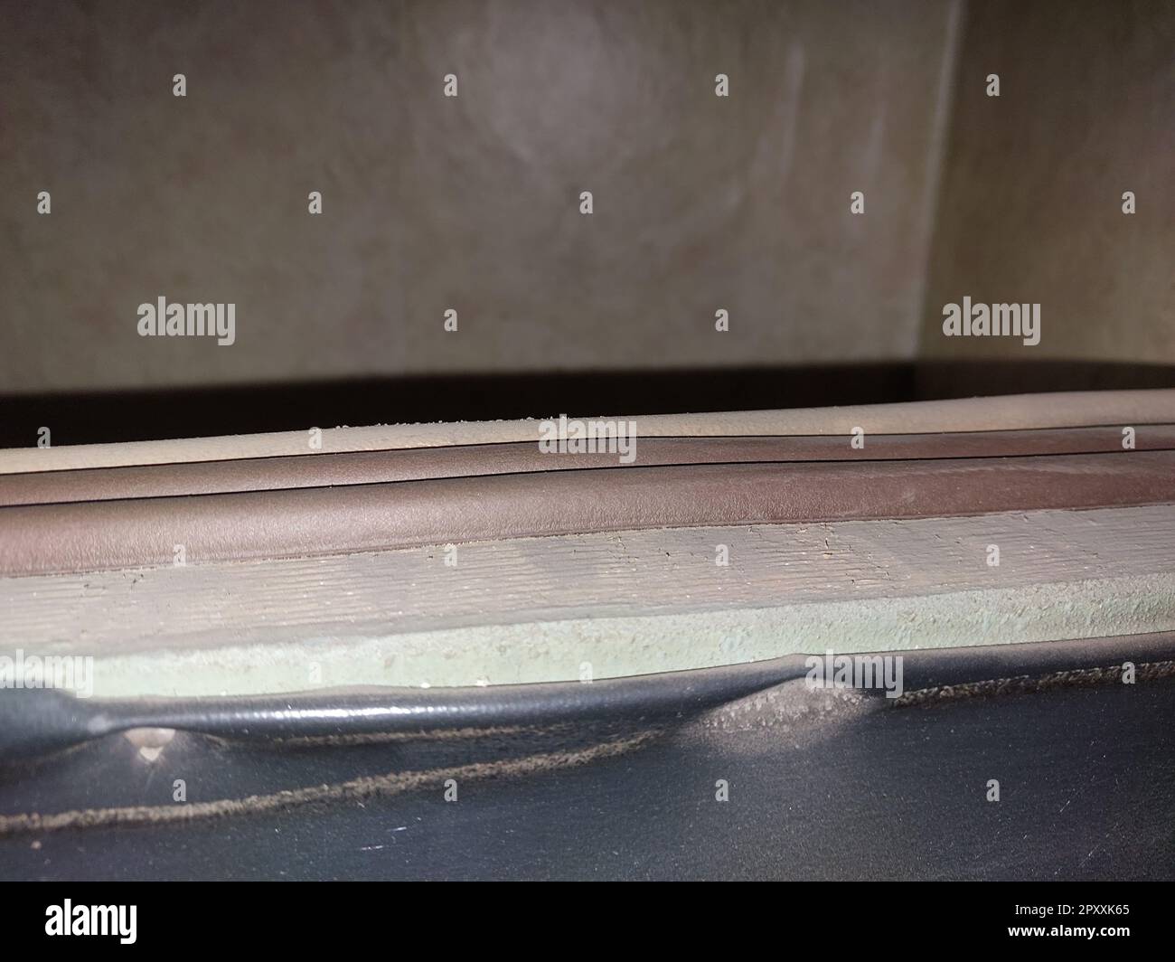 Installing a door seal against drafts and the odors Stock Photo Alamy