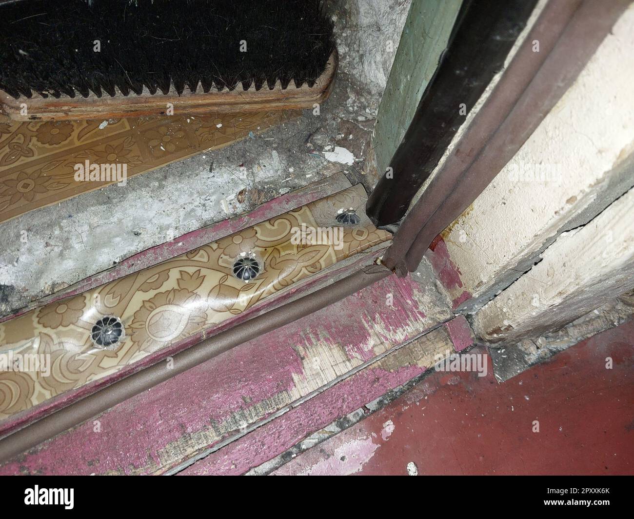 Installing a door seal against drafts and the odors Stock Photo Alamy