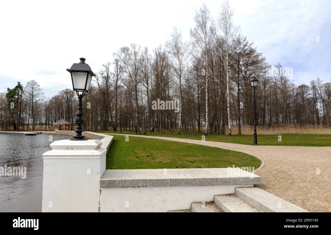 A street lamp on a path in the park Stock Photo