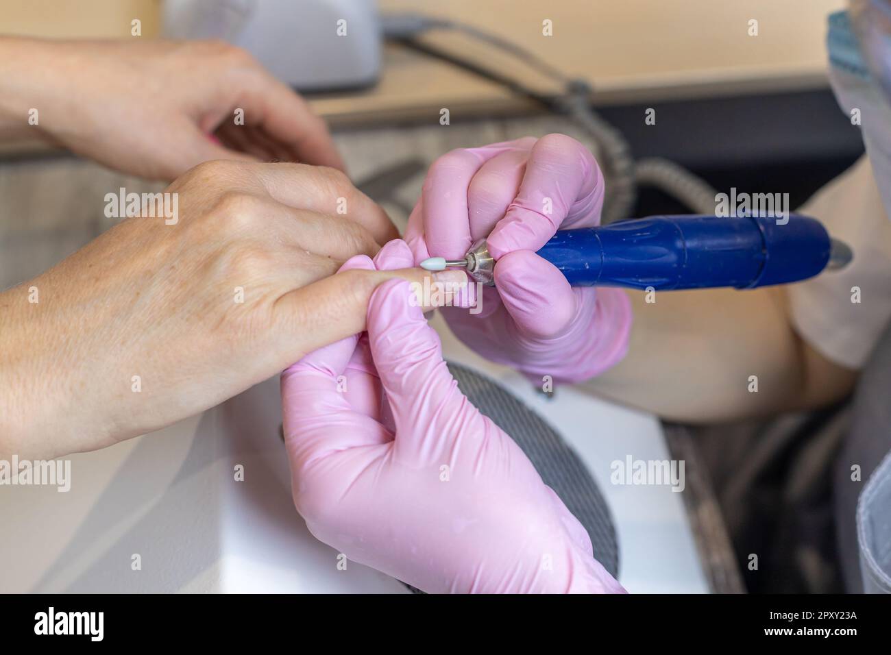 Nails manicure detail with file or brush item. Woman beautiful nail